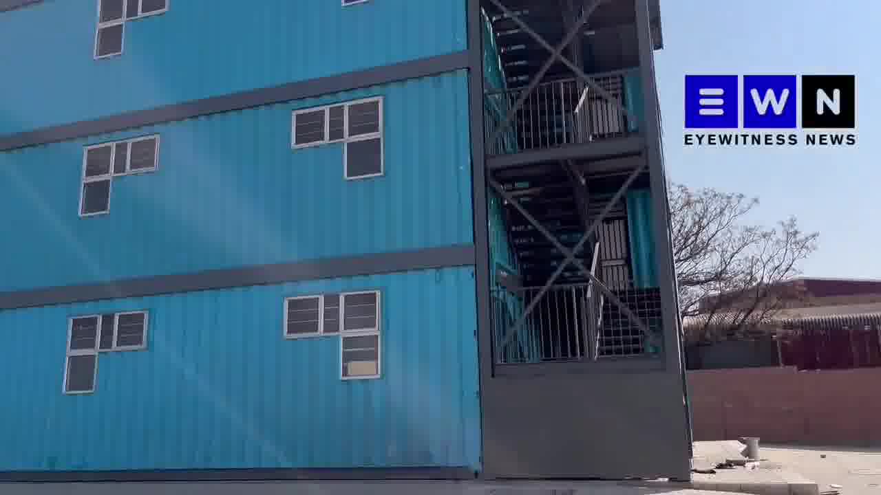 The government-owned container flats in Alexandra have been occupied again. Security that was guarding the place was chased away last night and their vehicle torched. On Sunday, Joburg EFF PR cllr, Moshe Mpahlele, was shot dead during a protest outside the flats. TCG